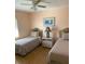Cozy bedroom with two twin beds, natural light, and a peaceful, relaxing atmosphere at 293 Broadmoor Ln, Rotonda West, FL 33947