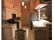 Well-lit kitchen showcasing white cabinets, sleek appliances, and neutral countertops at 293 Broadmoor Ln, Rotonda West, FL 33947