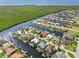 Bird's-eye view of a canal-front house with a private dock and waterfront access, surrounded by serene water and greenery at 3812 Carupano Ct, Punta Gorda, FL 33950