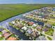 Expansive aerial shot of a waterfront home surrounded by canals, mature trees, and a community of beautiful homes at 3812 Carupano Ct, Punta Gorda, FL 33950