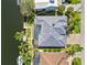 Birds eye view of property featuring screened-in pool, a dock and waterfront access at 3812 Carupano Ct, Punta Gorda, FL 33950