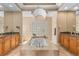 Lavish bathroom featuring granite countertops, custom cabinetry, a sunken tub, and glass block window at 3812 Carupano Ct, Punta Gorda, FL 33950
