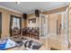 Spacious game room includes a pool table, bar stools, and a view from the window at 3812 Carupano Ct, Punta Gorda, FL 33950
