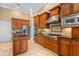 Gourmet kitchen with custom cabinetry, granite countertops, and high-end stainless steel appliances at 3812 Carupano Ct, Punta Gorda, FL 33950