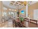 Elegant dining room and living area features a coffered ceiling and fireplace at 3812 Carupano Ct, Punta Gorda, FL 33950
