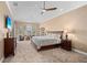 Comfortable main bedroom features neutral tones, fan, and a window for natural light at 3812 Carupano Ct, Punta Gorda, FL 33950
