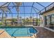 Stunning screened-in pool area overlooking the water, perfect for relaxation and entertaining at 3812 Carupano Ct, Punta Gorda, FL 33950