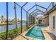 A lovely in-ground pool is encased within a screened lanai with waterfront views at 3812 Carupano Ct, Punta Gorda, FL 33950