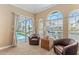 Comfortable sitting area provides access to the pool and canal views at 3812 Carupano Ct, Punta Gorda, FL 33950