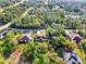 Aerial view of the home showcasing its position within a lush wooded neighborhood at 4221 Circleville St, North Port, FL 34286