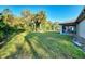 Large backyard features well-maintained lawn and mature trees providing a private outdoor space at 4221 Circleville St, North Port, FL 34286