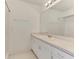 Bright bathroom with a long vanity, large mirror, and shower with white tile at 4221 Circleville St, North Port, FL 34286