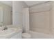 Bathroom with a sink, toilet, bathtub and shower with decorative tile accent at 4221 Circleville St, North Port, FL 34286