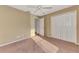 Bedroom with a ceiling fan, double closets, and ensuite bathroom entrance at 4221 Circleville St, North Port, FL 34286