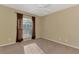 Bedroom with a large window, carpet flooring, and neutral-colored walls, creating a comfortable space at 4221 Circleville St, North Port, FL 34286