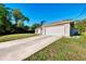 Charming single-story home featuring an attached two-car garage and spacious driveway at 4221 Circleville St, North Port, FL 34286