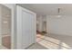 Bright foyer with white tile flooring and coat closet near the front door, leading into other living spaces at 4221 Circleville St, North Port, FL 34286