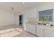 Kitchen with white cabinets and stainless steel sink at 4221 Circleville St, North Port, FL 34286
