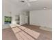 Open-concept living room with a ceiling fan, carpeted flooring, and access to the kitchen at 4221 Circleville St, North Port, FL 34286