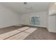 Bright living room with carpet, ceiling fan, and a large window at 4221 Circleville St, North Port, FL 34286