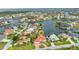 Gorgeous waterfront home with a red tile roof, circular driveway, and lush landscaping in a desirable neighborhood at 480 Macedonia Dr, Punta Gorda, FL 33950