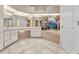 Large bathroom with an alcove tub, tile floor and vanity at 480 Macedonia Dr, Punta Gorda, FL 33950