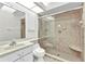 A well-lit bathroom featuring a tiled shower and vanity at 480 Macedonia Dr, Punta Gorda, FL 33950