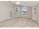 The airy bedroom features large arched windows with outdoor views at 480 Macedonia Dr, Punta Gorda, FL 33950