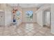 Bright foyer with decorative tile flooring, stained-glass doors, arch window, and high ceilings at 480 Macedonia Dr, Punta Gorda, FL 33950