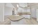 Bright kitchen with white cabinets, a kitchen island and pendant lighting at 480 Macedonia Dr, Punta Gorda, FL 33950