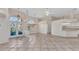 Spacious living room area featuring high ceilings, decorative tile flooring, a ceiling fan, and arch windows at 480 Macedonia Dr, Punta Gorda, FL 33950