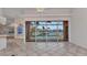 Spacious open-plan living room with views of the pool and canal beyond at 480 Macedonia Dr, Punta Gorda, FL 33950