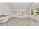 Bright room with built-in shelving and a view of the outside at 480 Macedonia Dr, Punta Gorda, FL 33950