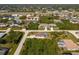 Spacious single Gathering homes surrounded by mature trees in a quiet residential neighborhood from an aerial view at 7014 Baylor Street, Englewood, FL 34224