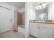 Clean bathroom features a tub, shower, vanity, and tiled floors provides a functional space at 7014 Baylor Street, Englewood, FL 34224