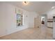 Bright dining area with a window, tiled floor and neutral decor provides a cozy space for meals at 7014 Baylor Street, Englewood, FL 34224