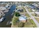 Aerial view of a waterfront property featuring boat dock and lush landscaping at 721 Dania Ct, Punta Gorda, FL 33950