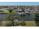 Picturesque waterfront views with backyard canal access and lush landscaping at 721 Dania Ct, Punta Gorda, FL 33950