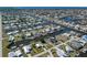 Aerial view showcasing the waterfront home's location on a canal within a community, perfect for boating enthusiasts at 721 Dania Ct, Punta Gorda, FL 33950