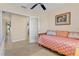 Cozy bedroom with a daybed, ceiling fan and framed art at 721 Dania Ct, Punta Gorda, FL 33950