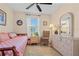 Comfortable bedroom with wicker furniture, neutral tones, and ample natural light at 721 Dania Ct, Punta Gorda, FL 33950