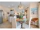 Open dining area with modern furnishings, easy access to the kitchen, and a bright atmosphere at 721 Dania Ct, Punta Gorda, FL 33950