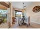 Cozy dining area featuring a glass table and a charming view of the waterfront at 721 Dania Ct, Punta Gorda, FL 33950