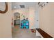 Bright entryway with tiled floor, storage cubes and bench at 721 Dania Ct, Punta Gorda, FL 33950