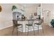 Kitchen featuring white cabinets, stainless steel appliances, and a breakfast bar with seating at 721 Dania Ct, Punta Gorda, FL 33950