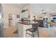 Open kitchen flows into the living room, featuring a breakfast bar and modern appliances at 721 Dania Ct, Punta Gorda, FL 33950