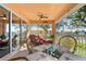 Relaxing screened lanai featuring a table and chairs for outdoor dining and lounge chairs for relaxation at 721 Dania Ct, Punta Gorda, FL 33950