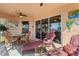 Cozy screened lanai with comfortable lounge seating and dining area, perfect for relaxing and enjoying the outdoors at 721 Dania Ct, Punta Gorda, FL 33950