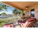 Inviting screened-in lanai features a dining table and comfortable lounge chairs overlooking a scenic waterfront view at 721 Dania Ct, Punta Gorda, FL 33950