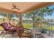 Relaxing screened lanai with comfortable seating and views of the canal, ideal for outdoor living at 721 Dania Ct, Punta Gorda, FL 33950